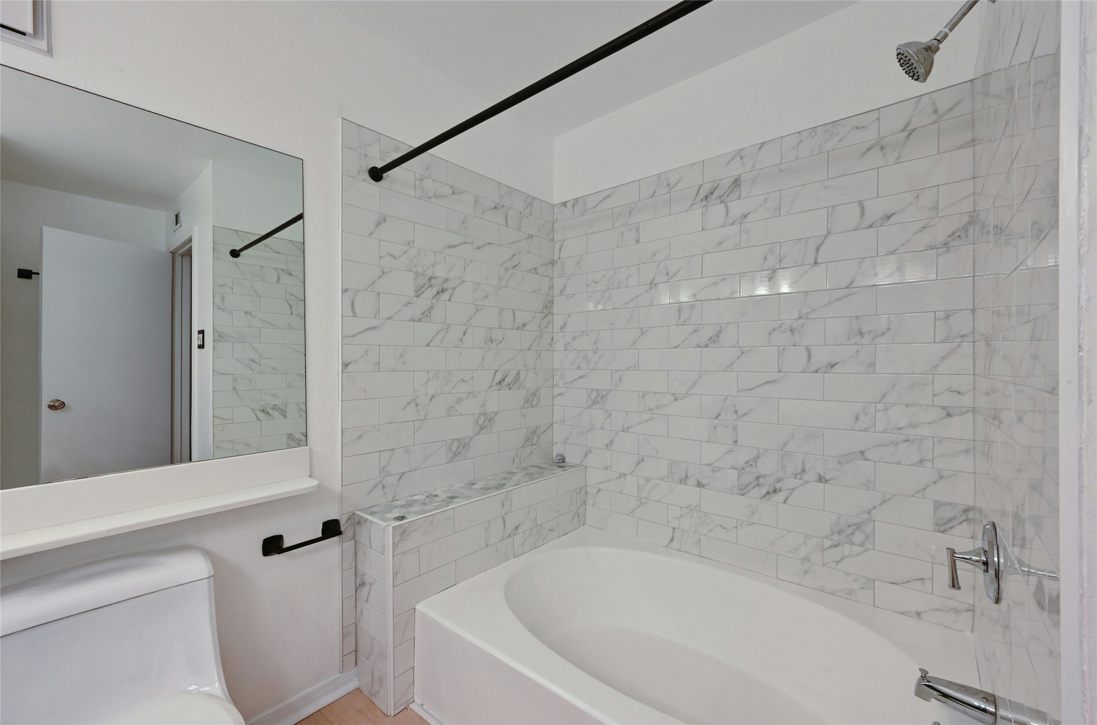 2450 Wickersham Lane, Unit 710 Austin, TX 78741 - Photo 17 of 20 a bathroom with a bathtub and a shower