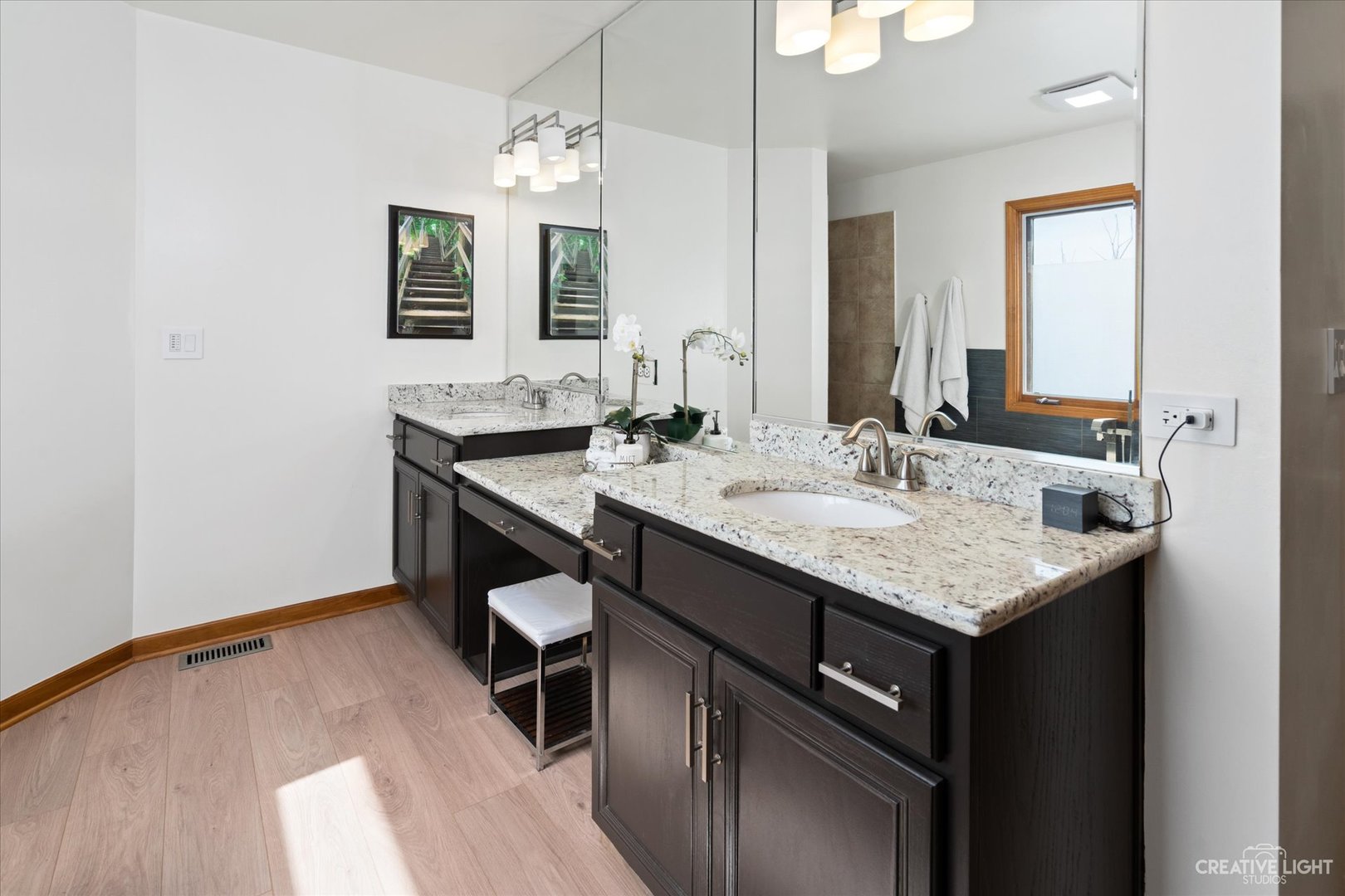 3812 Mistflower Lane Naperville, IL 60564 - Photo 22 of 49 a bathroom with a granite countertop sink a mirror and a vanity