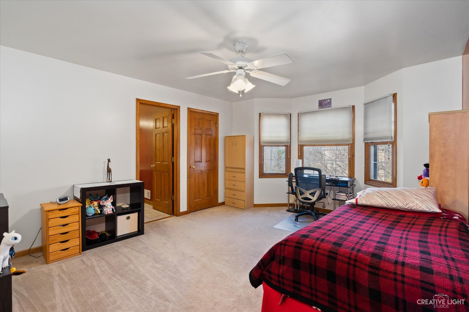 3812 Mistflower Lane Naperville, IL 60564 - Photo 25 of 49 a bedroom with bed and a chandelier