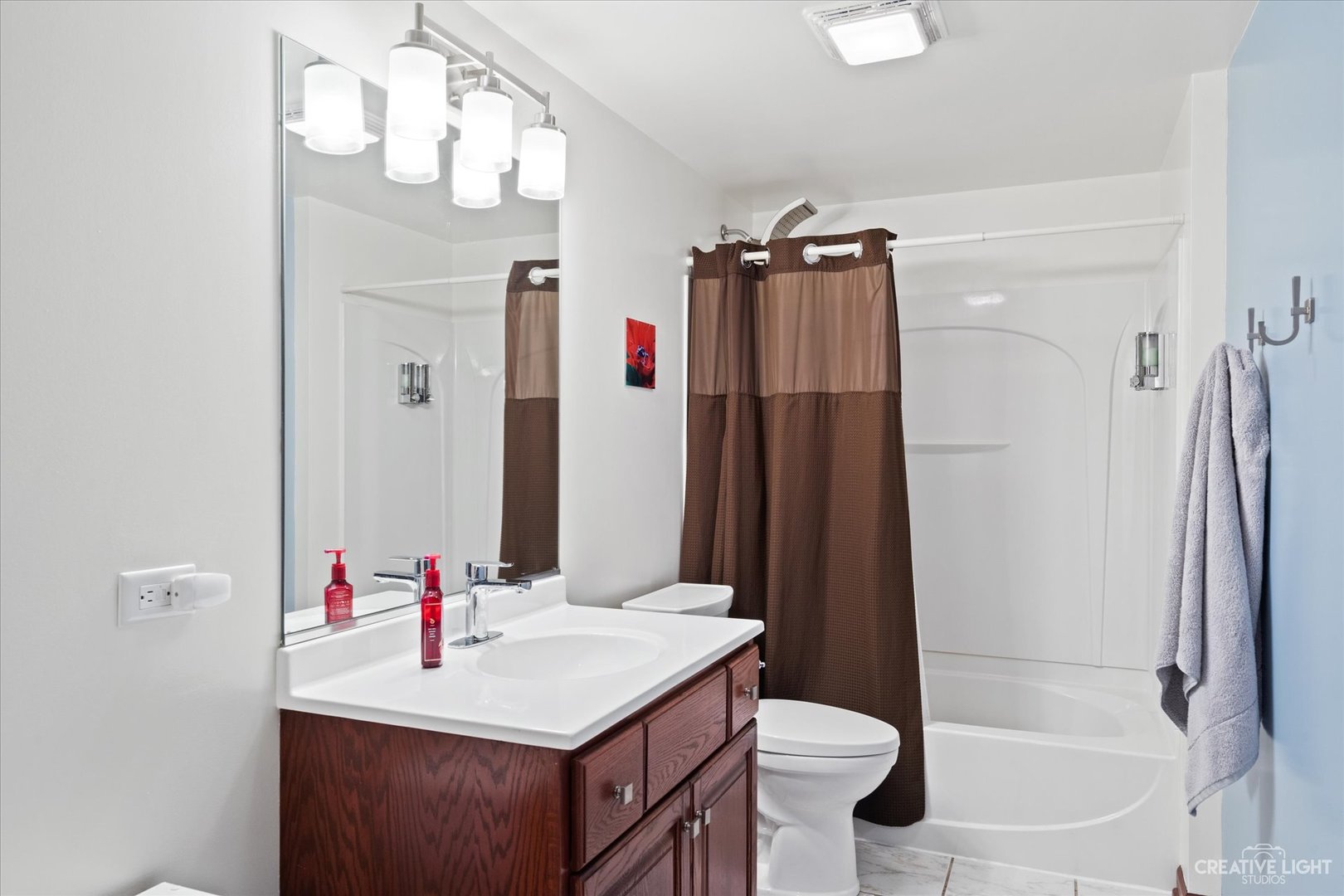 3812 Mistflower Lane Naperville, IL 60564 - Photo 31 of 49 a bathroom with a sink vanity toilet and shower