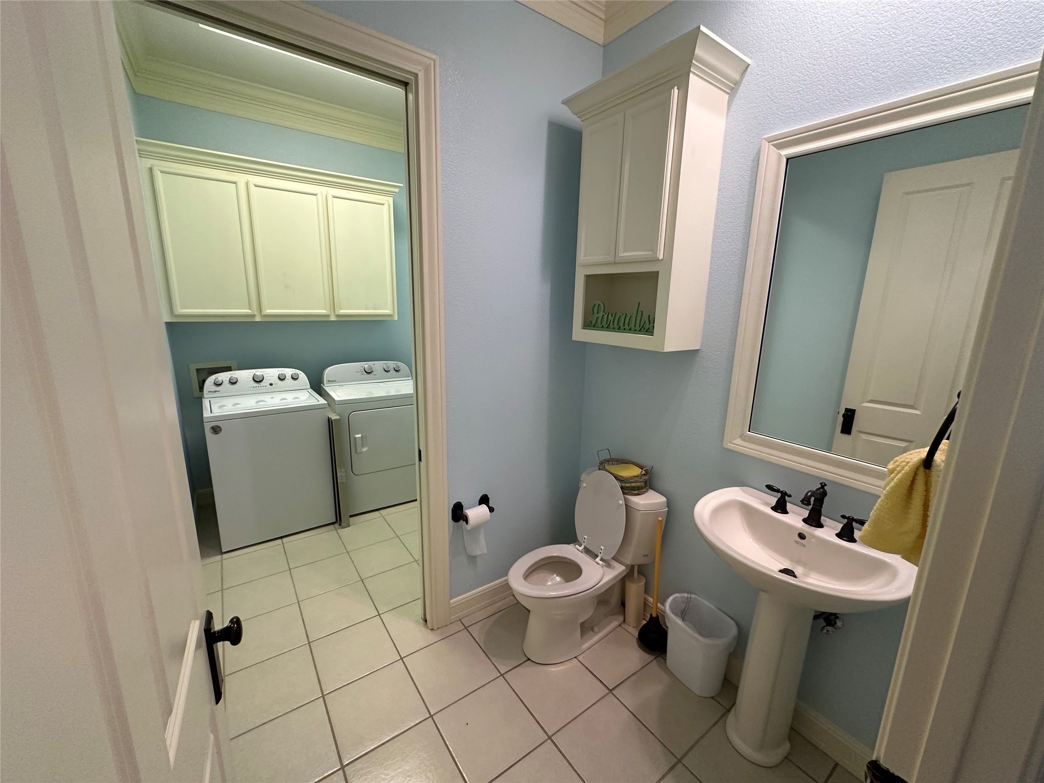 2529 Howell Crystal Beach, TX 77650 - Photo 18 of 41 a bathroom with a sink toilet and mirror