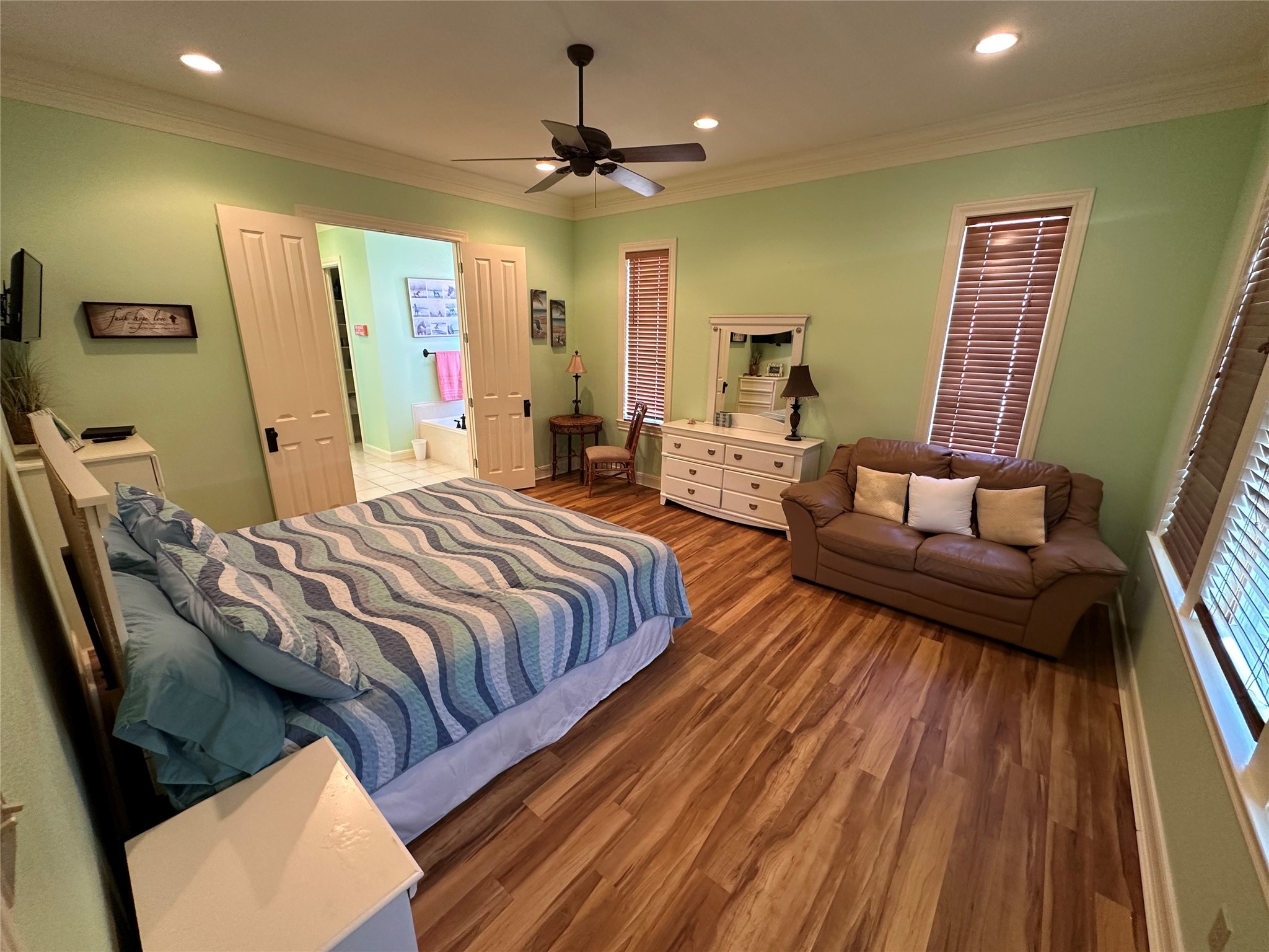 2529 Howell Crystal Beach, TX 77650 - Photo 20 of 41 a bedroom with a bed and wooden floor