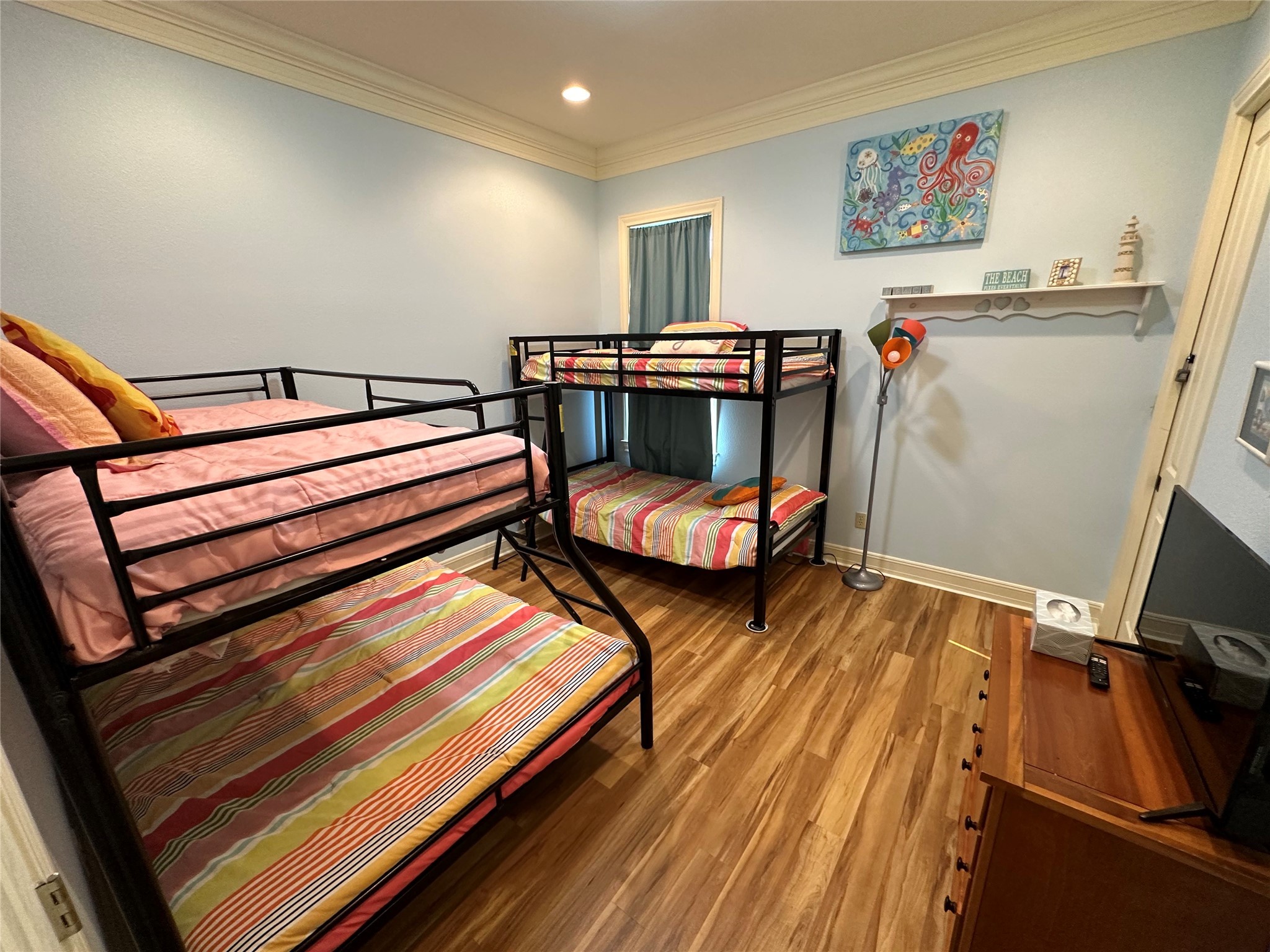 2529 Howell Crystal Beach, TX 77650 - Photo 29 of 41 a bedroom with two beds and a desk