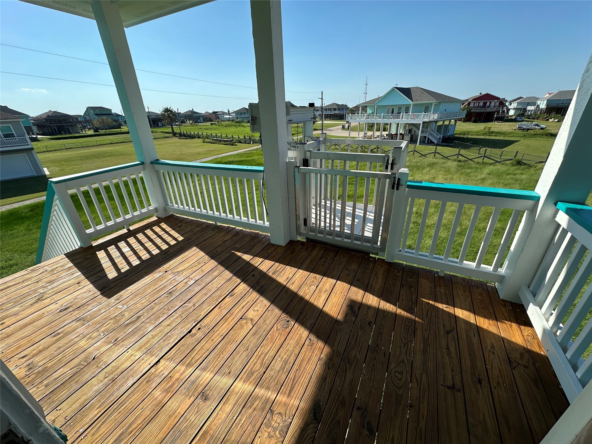 2529 Howell Crystal Beach, TX 77650 - Photo 10 of 41 a view of a balcony with wooden floor next to a yard