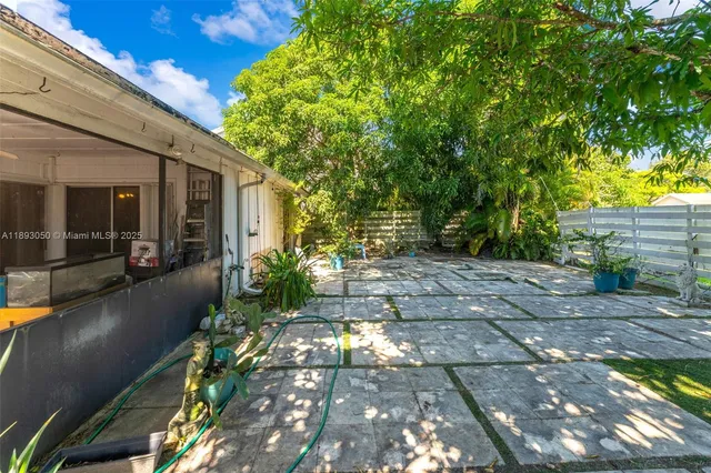 a view of a pathway with a patio
