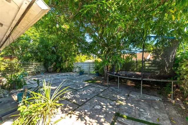 a view of a bench in a backyard
