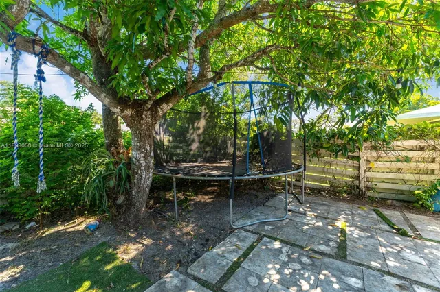 a view of a bench in a backyard