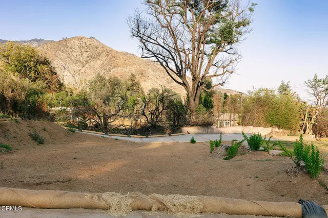 a view of a backyard of a house