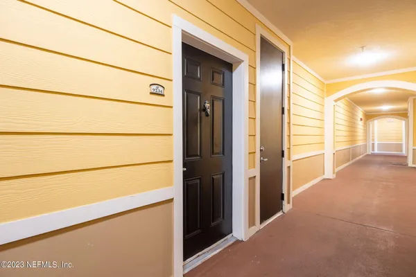 a view of a closet area with an empty room