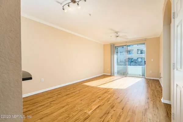 a view of an empty room with a window