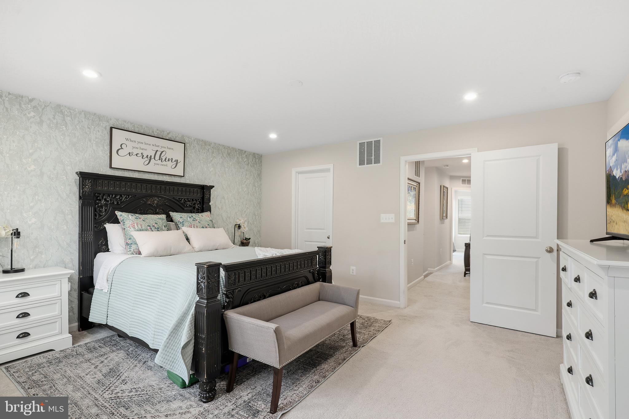 18319 Summit Pointe Drive Triangle, VA 22172 - Photo 15 of 40 a bed room with a bed and a television