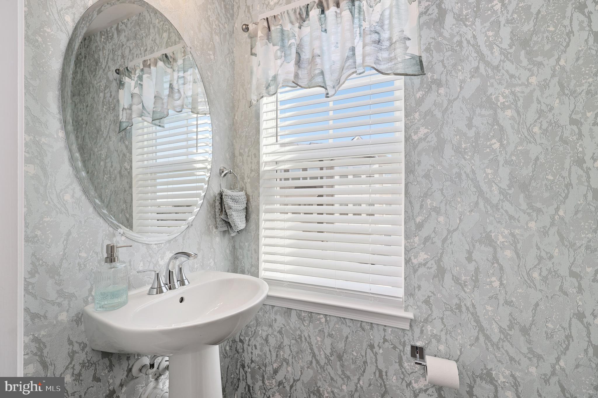 18319 Summit Pointe Drive Triangle, VA 22172 - Photo 20 of 40 a bathroom with a sink and a mirror
