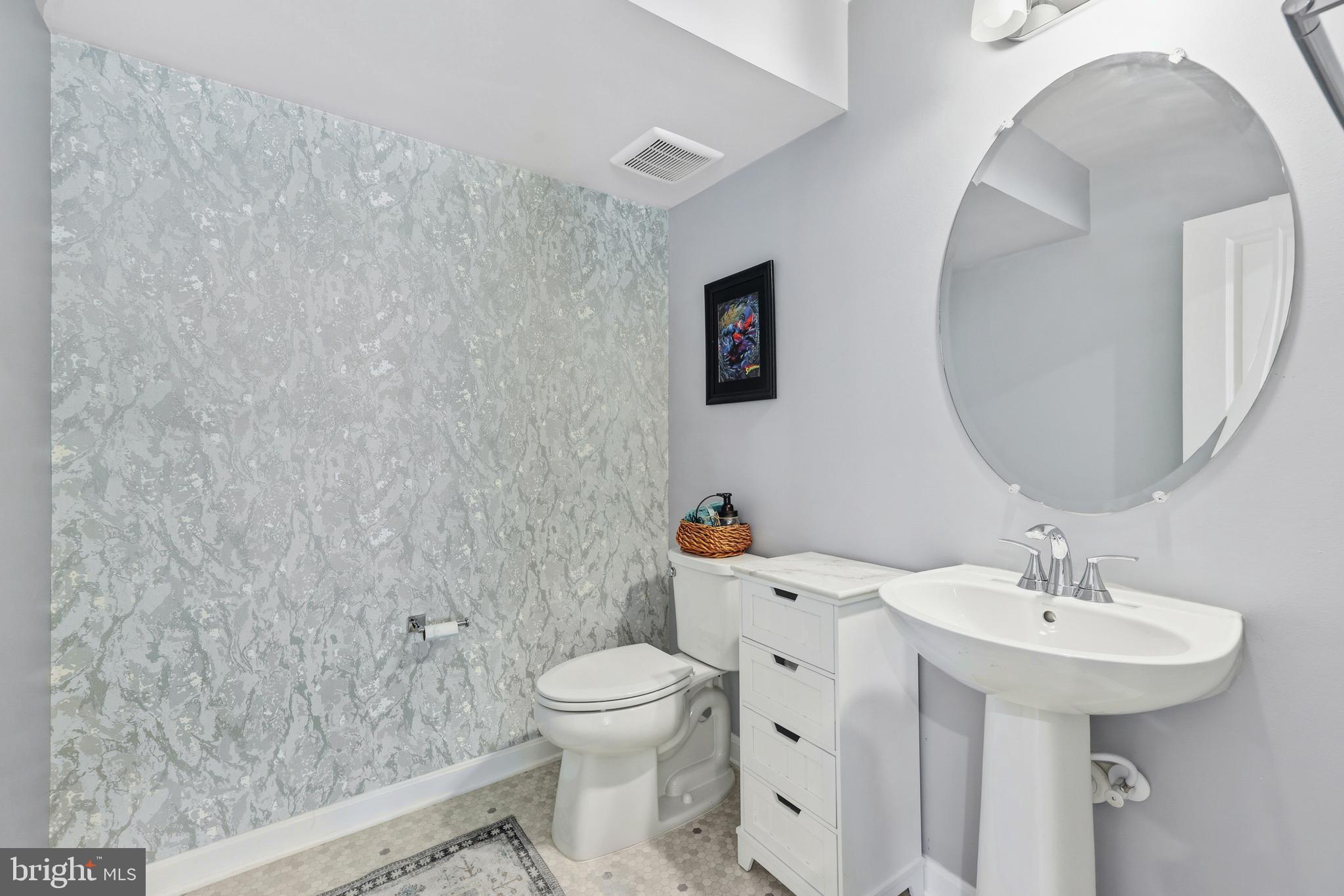 18319 Summit Pointe Drive Triangle, VA 22172 - Photo 24 of 40 a bathroom with a sink toilet and mirror