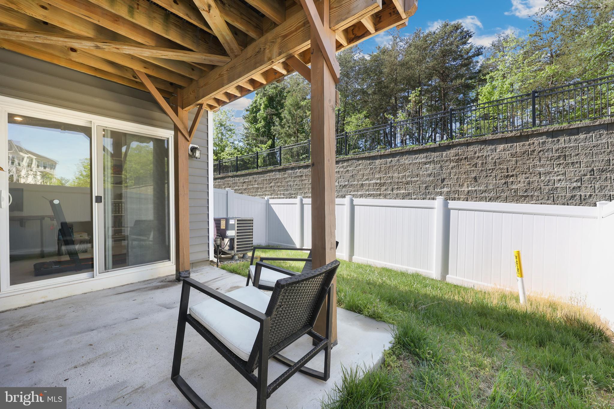 18319 Summit Pointe Drive Triangle, VA 22172 - Photo 29 of 40 a view of a chair and table in backyard of the house