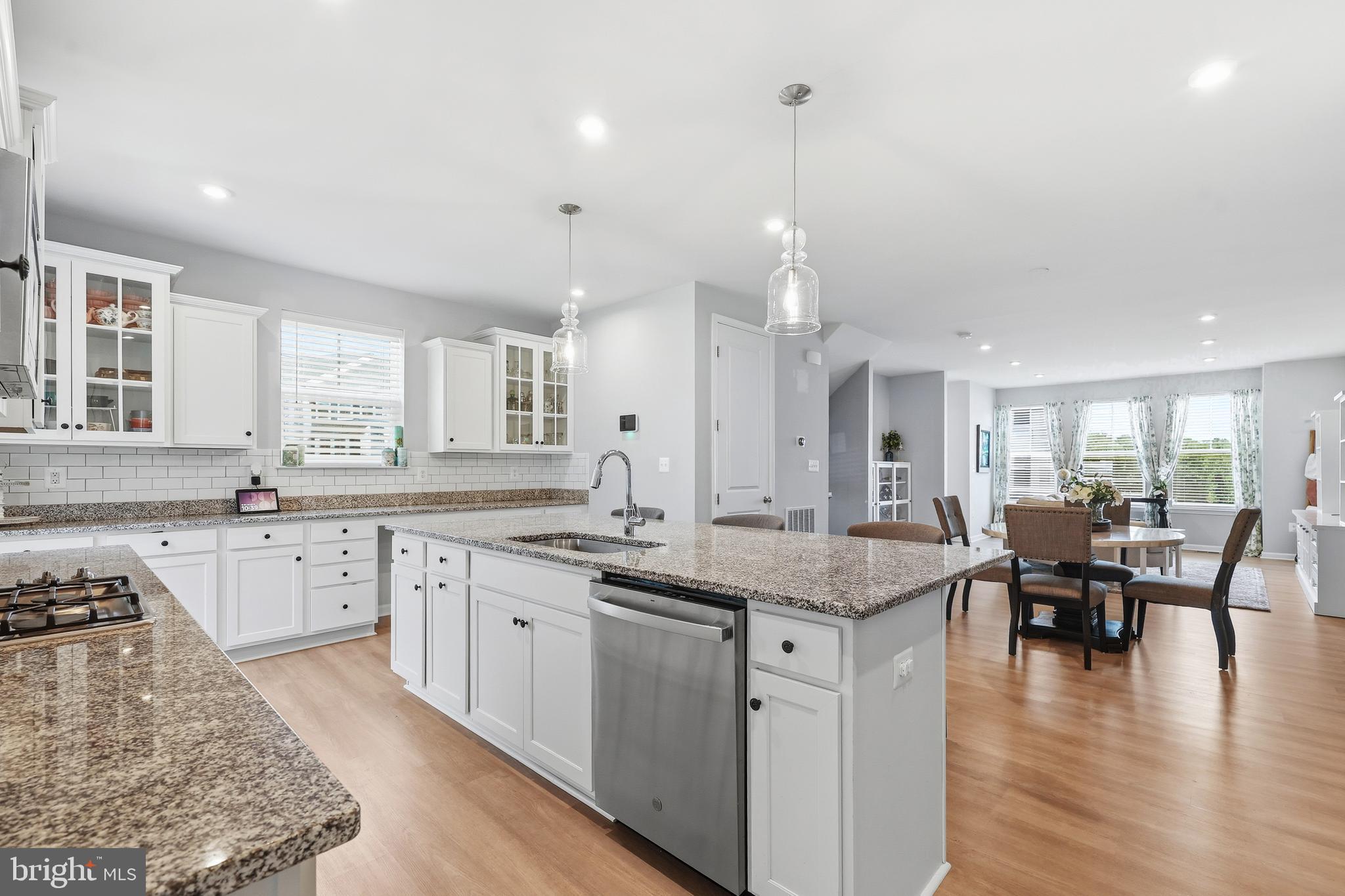 18319 Summit Pointe Drive Triangle, VA 22172 - Photo 10 of 40 a kitchen with center island table and chairs