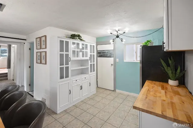 a kitchen with stainless steel appliances granite countertop a refrigerator and a stove