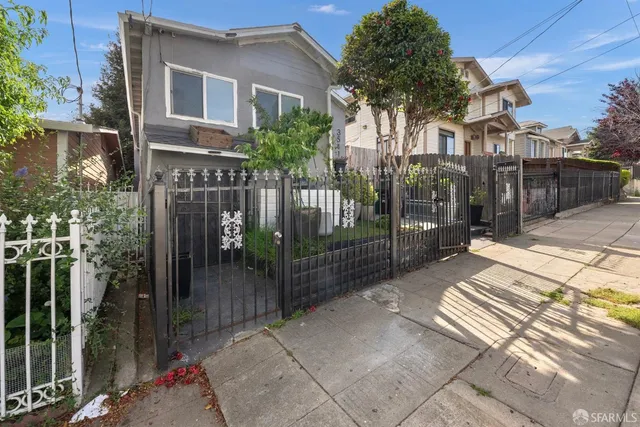 an aerial view of a house with swimming pool and outdoor space