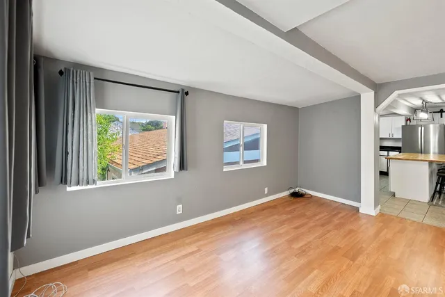 a view of an empty room with a window