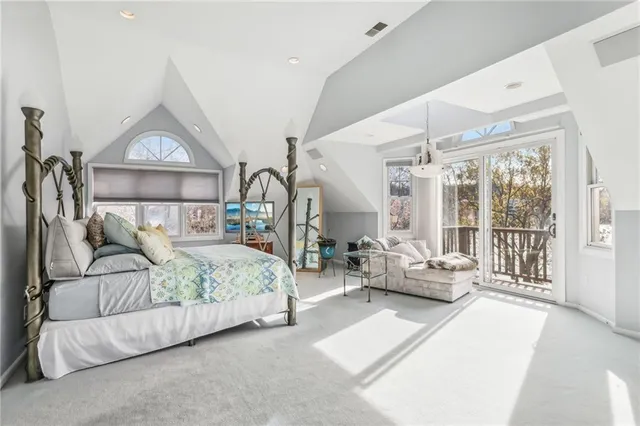 a living room with furniture a rug and white walls