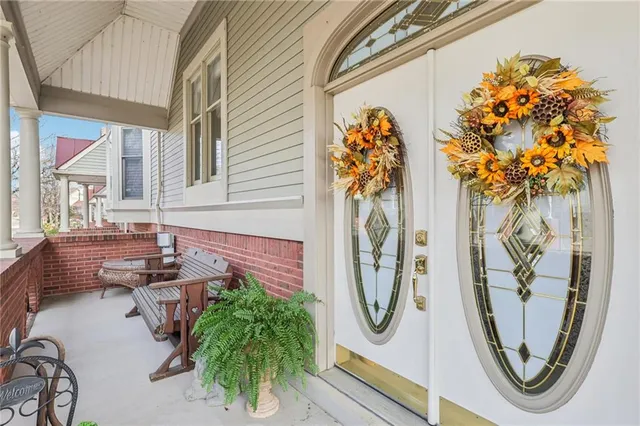 a front view of a house with outdoor seating
