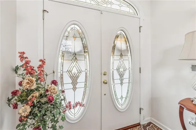 a living room with lots of furniture and a large window