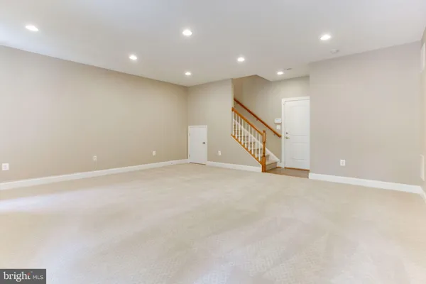 an empty room with stairs and ventilation