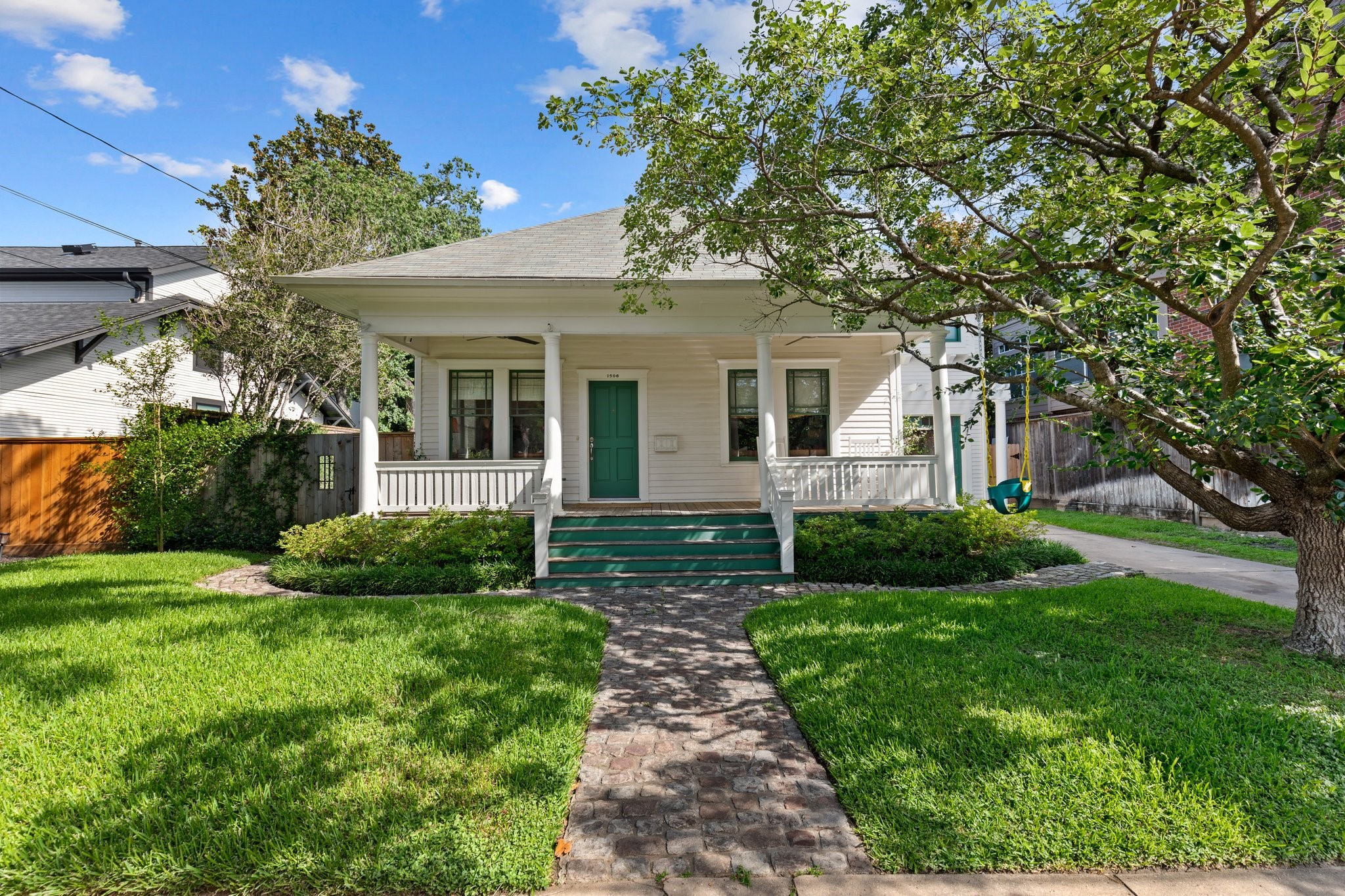 a front view of a house with garden