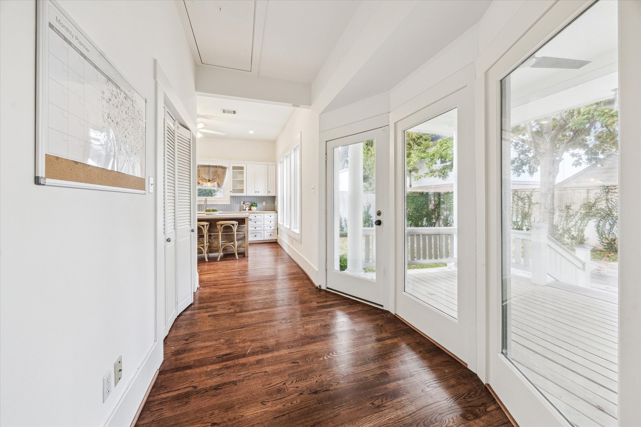 1506 Indiana Street Houston, TX 77006 - Photo 14 of 37 a view of a hallway with wooden floor windows