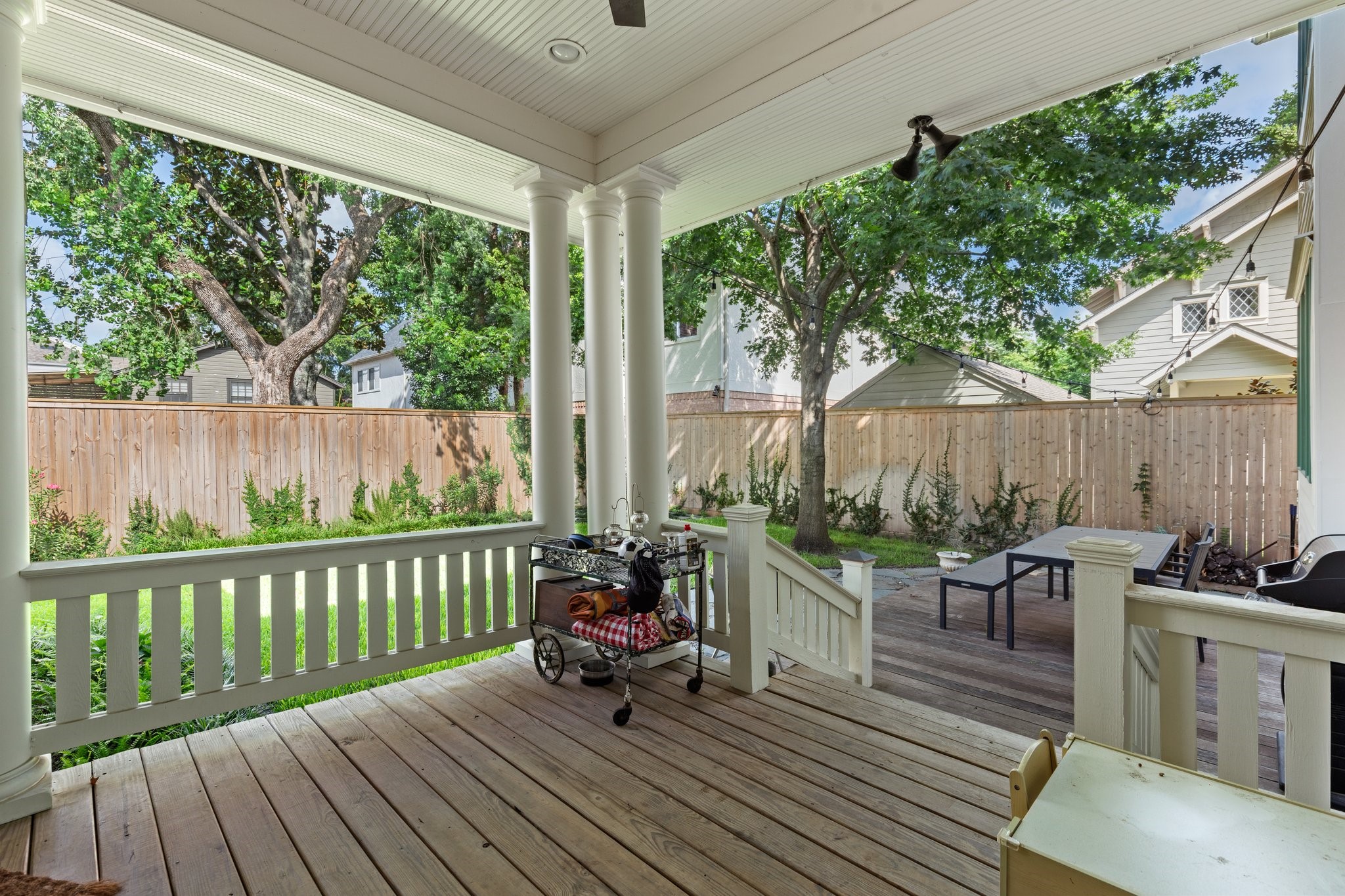 1506 Indiana Street Houston, TX 77006 - Photo 15 of 37 a view of a deck with wooden floor and outdoor seating