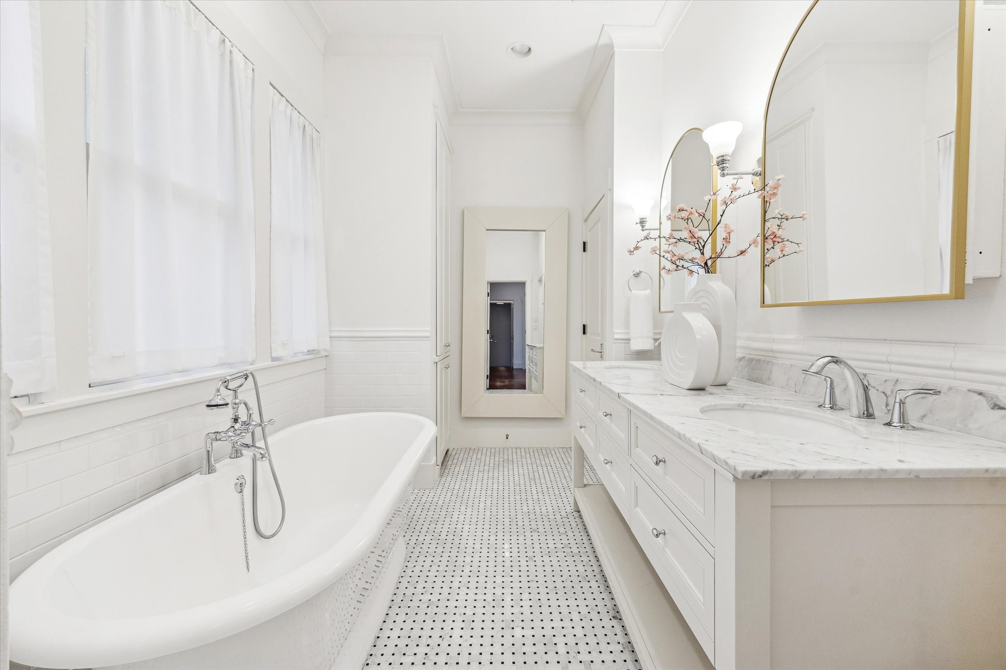 1506 Indiana Street Houston, TX 77006 - Photo 19 of 37 a bathroom with a double vanity sink and a mirror