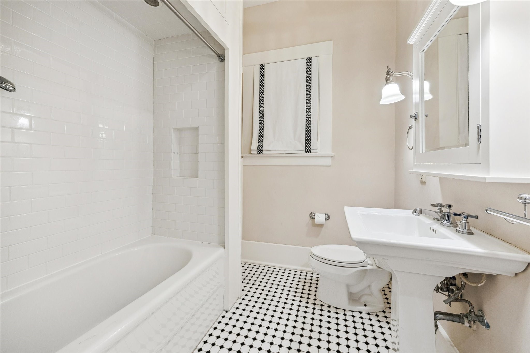 1506 Indiana Street Houston, TX 77006 - Photo 23 of 37 a bathroom with a sink a toilet and shower