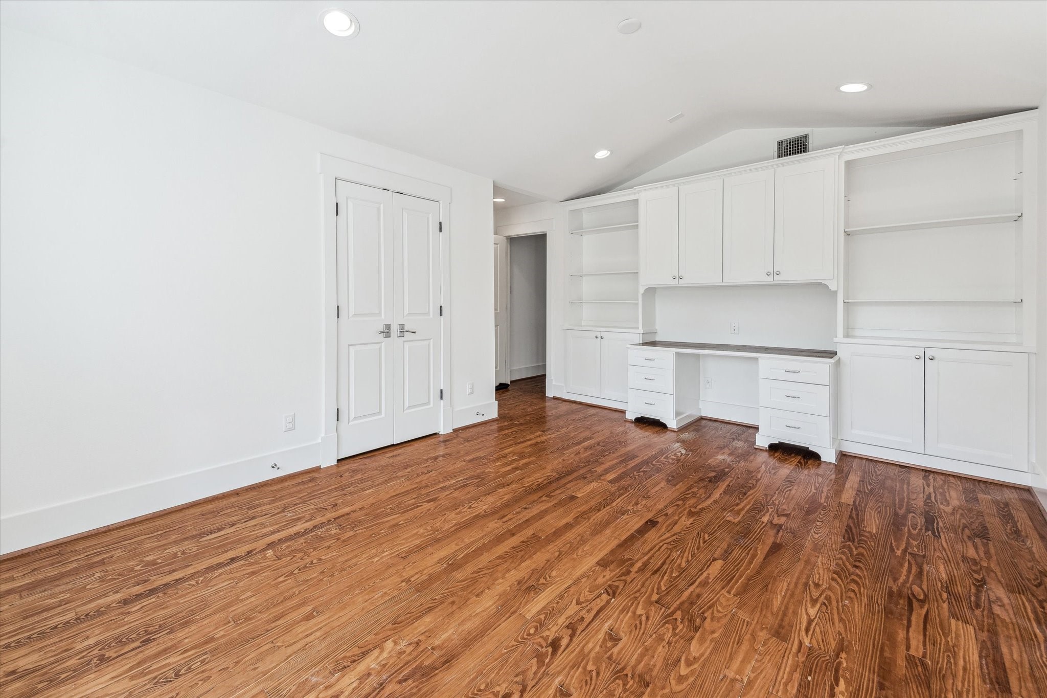 1506 Indiana Street Houston, TX 77006 - Photo 27 of 37 a view of empty room with wooden floor and kitchen