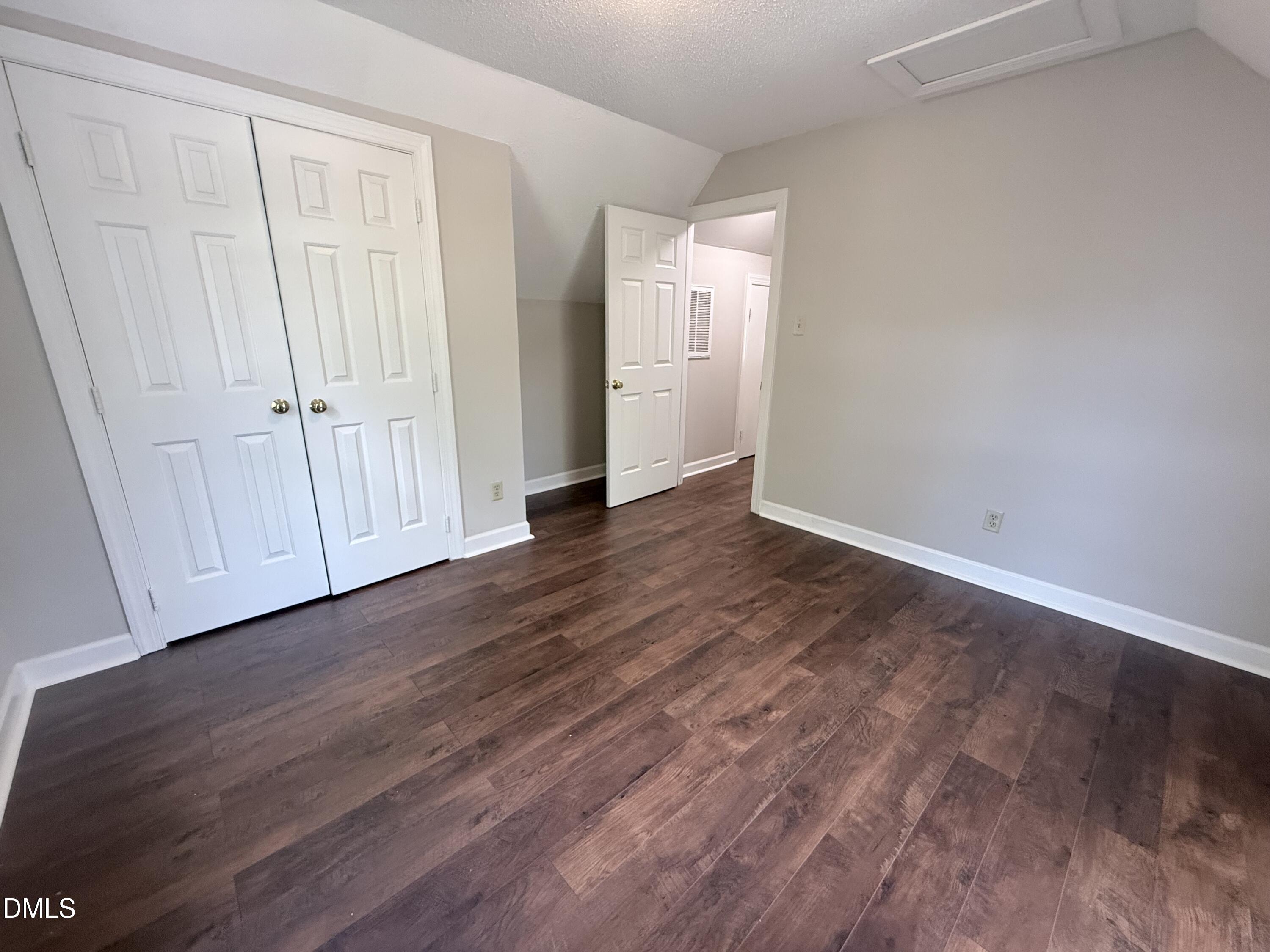 2900 Broadlands Drive Raleigh, NC 27604 - Photo 46 of 60 a view of an empty room with wooden floor