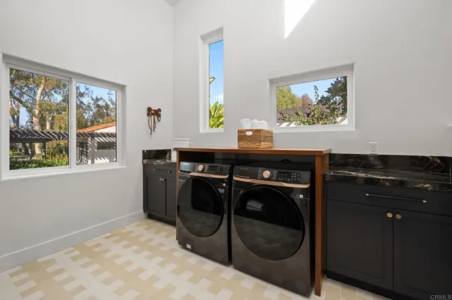 a view of a hallway with washer and dryer