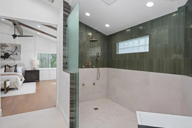 a bathroom with a bathtub and a shower
