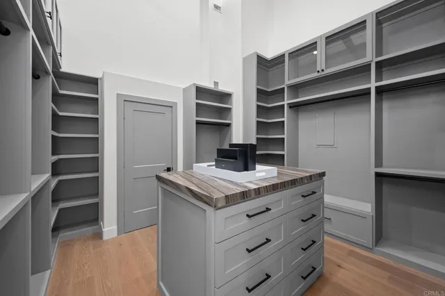 a kitchen with a stove and cabinets