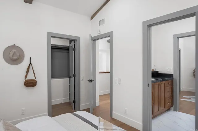 a view of hallway with wooden floor
