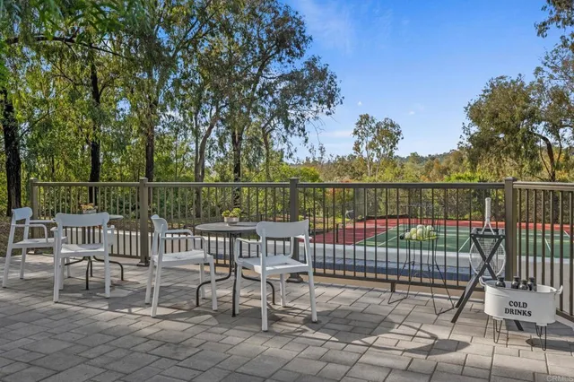 a view of a chair and table on the roof deck
