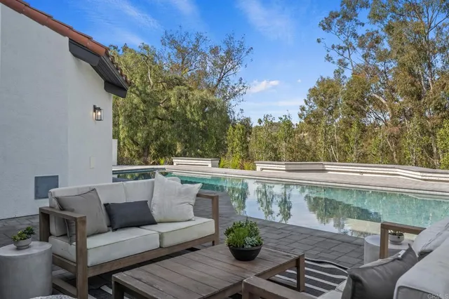 a view of a balcony with furniture