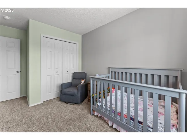 a bed room with a bed and a window