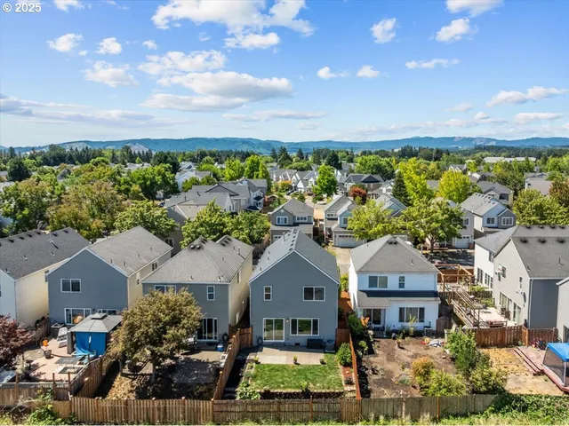 a view of a garden with a building in the background