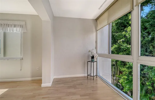 a view of an entryway with wooden floor