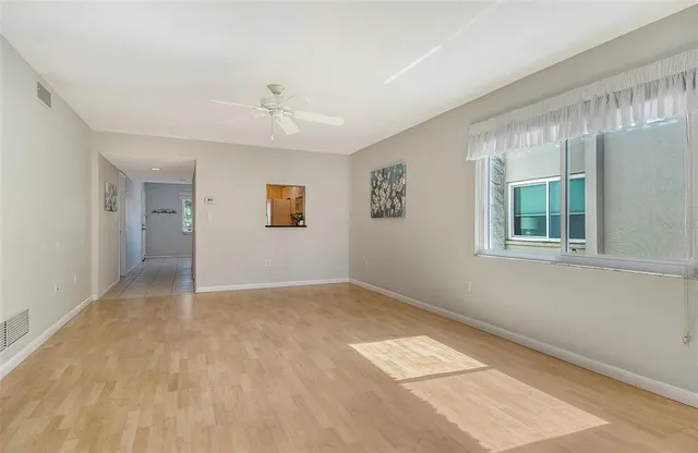 a view of empty room with windows