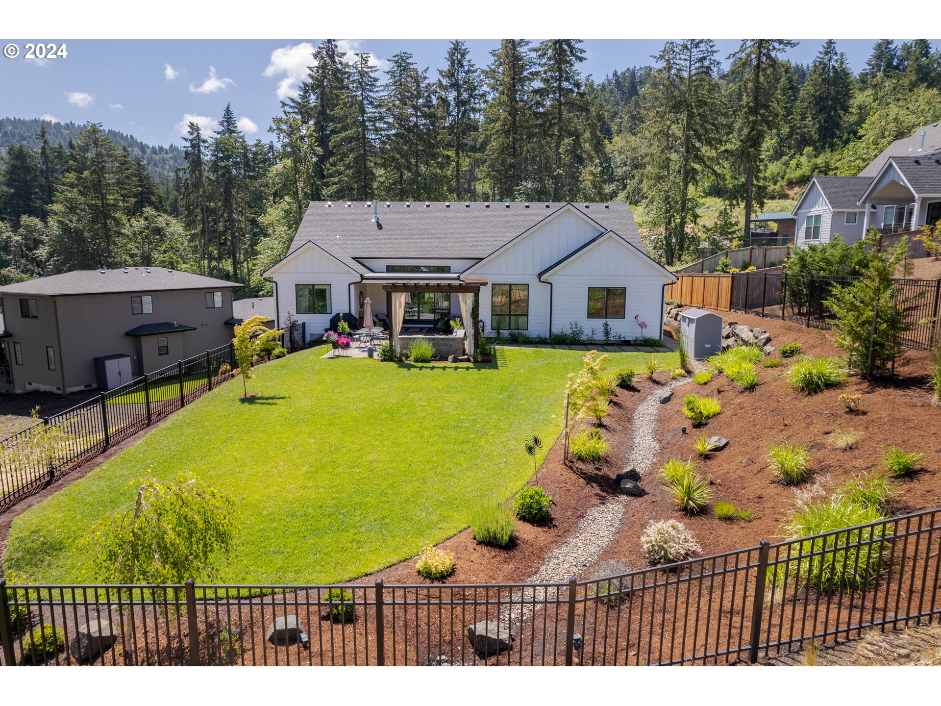 971 South 66th Place Springfield, OR 97478 - Photo 44 of 48 a view of a house with a yard