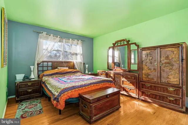 a bedroom with a bed next to a window with outer view