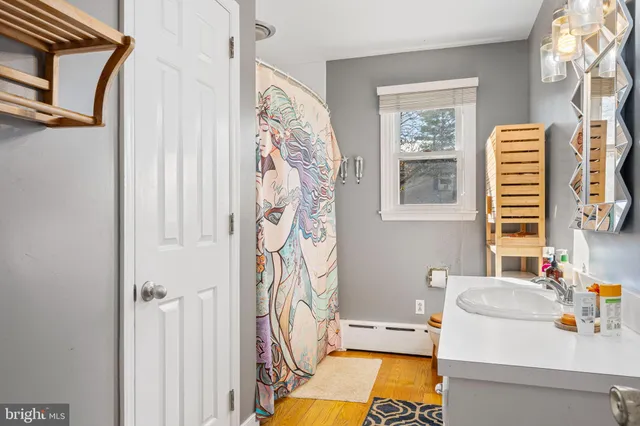 a bathroom with a tub and a window