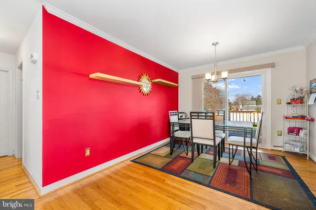 a reading room with furniture pool table and a window