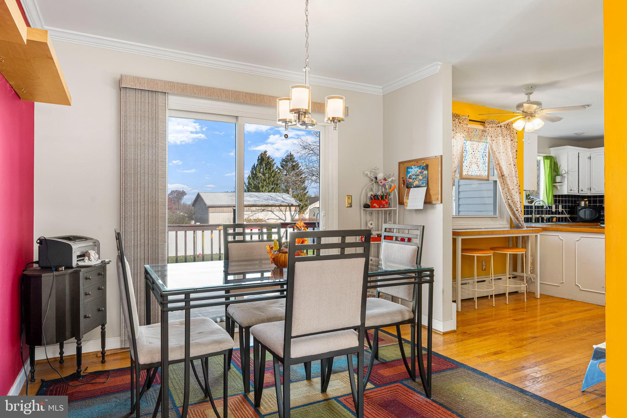 187 North Hazel Street Manheim, PA 17545 - Photo 6 of 28 a dining room with furniture a chandelier and wooden floor