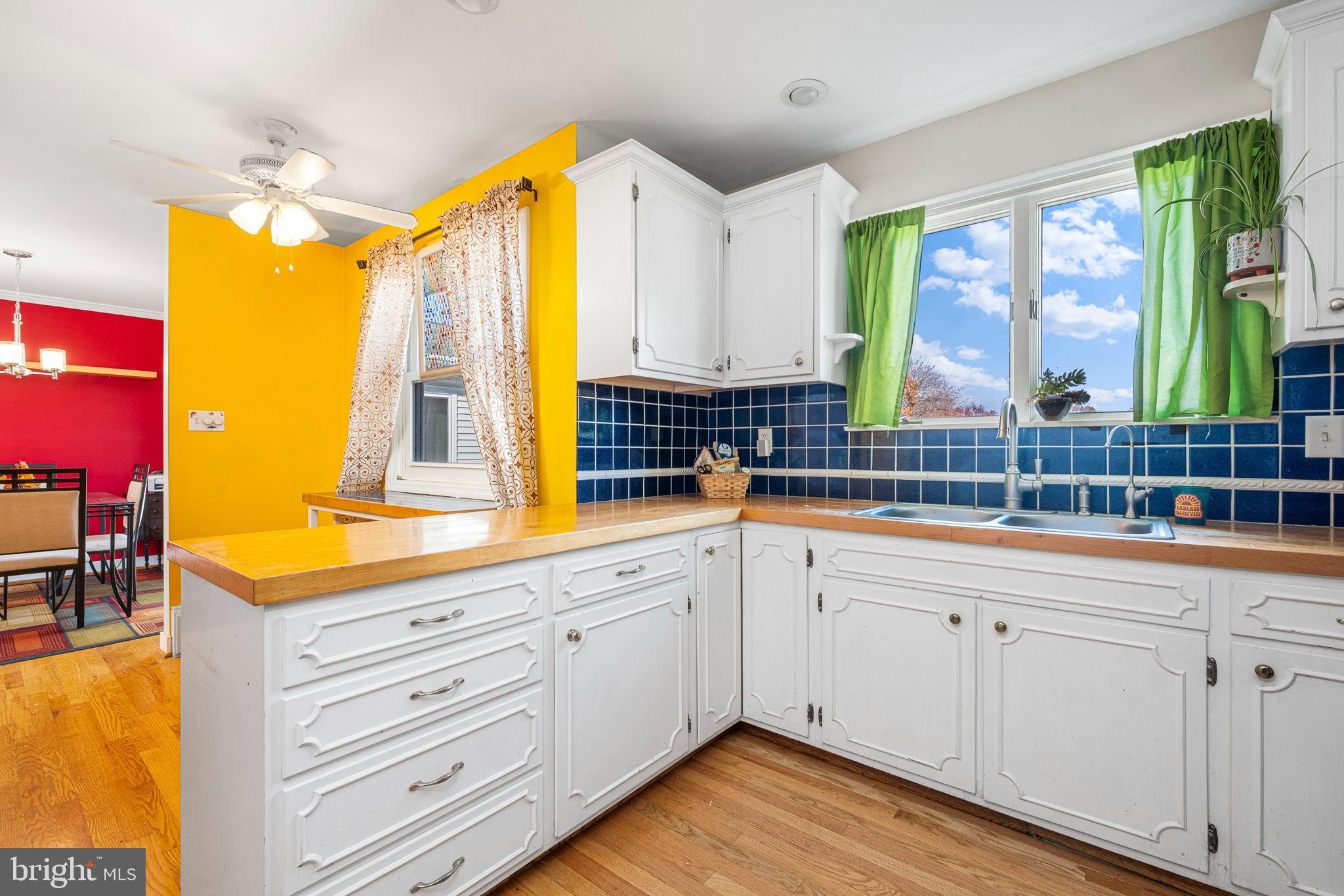 187 North Hazel Street Manheim, PA 17545 - Photo 7 of 28 a kitchen with sink cabinets and wooden floor