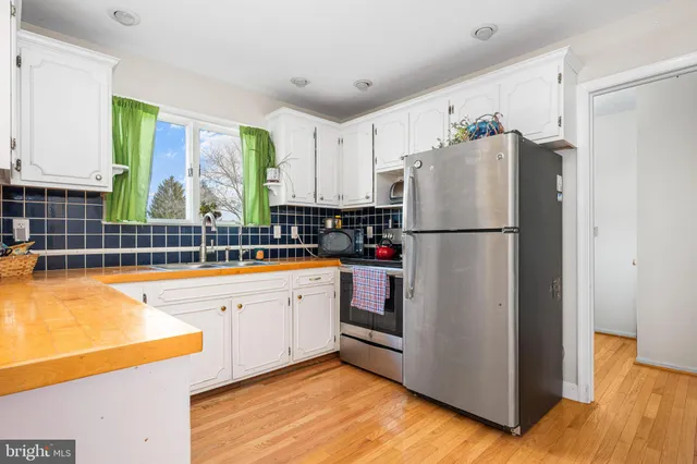 a white refrigerator freezer sitting in a kitchen